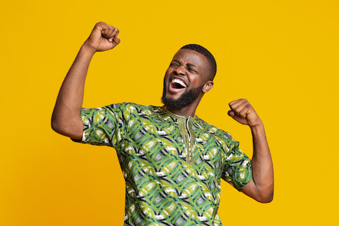 the cloud advantage - Calabrio ONE - Black man showing positive emotions over yellow background