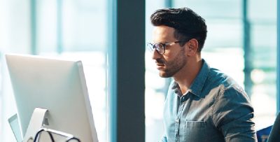 Image of man working at computer