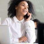 Contact center agent smiles on phonecall